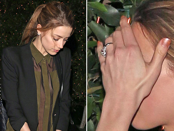 A bashful Amber Heard keeps her head down after dinner at Ago