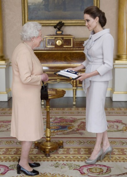 Angelina Jolie collects her honorary damehood from The Queen on October 10 2014